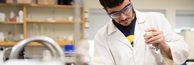 Student performing chemistry experiment